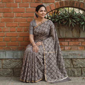 Brown Bagru Hand Block Print Natural Dyed Mulberry Silk Saree, draped and worn by a woman, AI visual of the saree, iTokri
