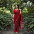 Maroon Bamboo Silk Thread Buti Assam Pure Handwoven Saree with Blouse Piece, draped and worn by a woman, AI visual of the saree, iTokri