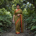 Olive Bamboo Silk Thread Buti Assam Pure Handwoven Saree with Blouse Piece, draped and worn by a woman, AI visual of the saree, iTokri