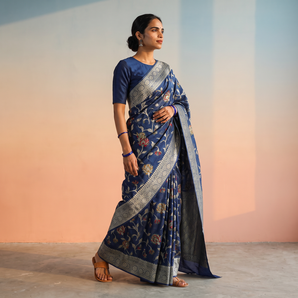 Blue Banarasi Pure Handwoven Georgette Meena Buti Zari Jaal Work Saree, draped and worn by a woman, AI visual of the saree, iTokri