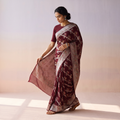 Maroon Banarasi Pure Handwoven Georgette Meena Buti Zari Jaal Work Saree, draped and worn by a woman, AI visual of the saree, iTokri