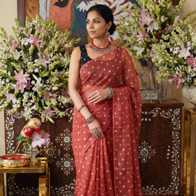 Red Bandhani tie-dye Kota Doria cotton saree, draped and worn by a woman, by artisan Adil Hussain, AI visual of the saree, iTokri