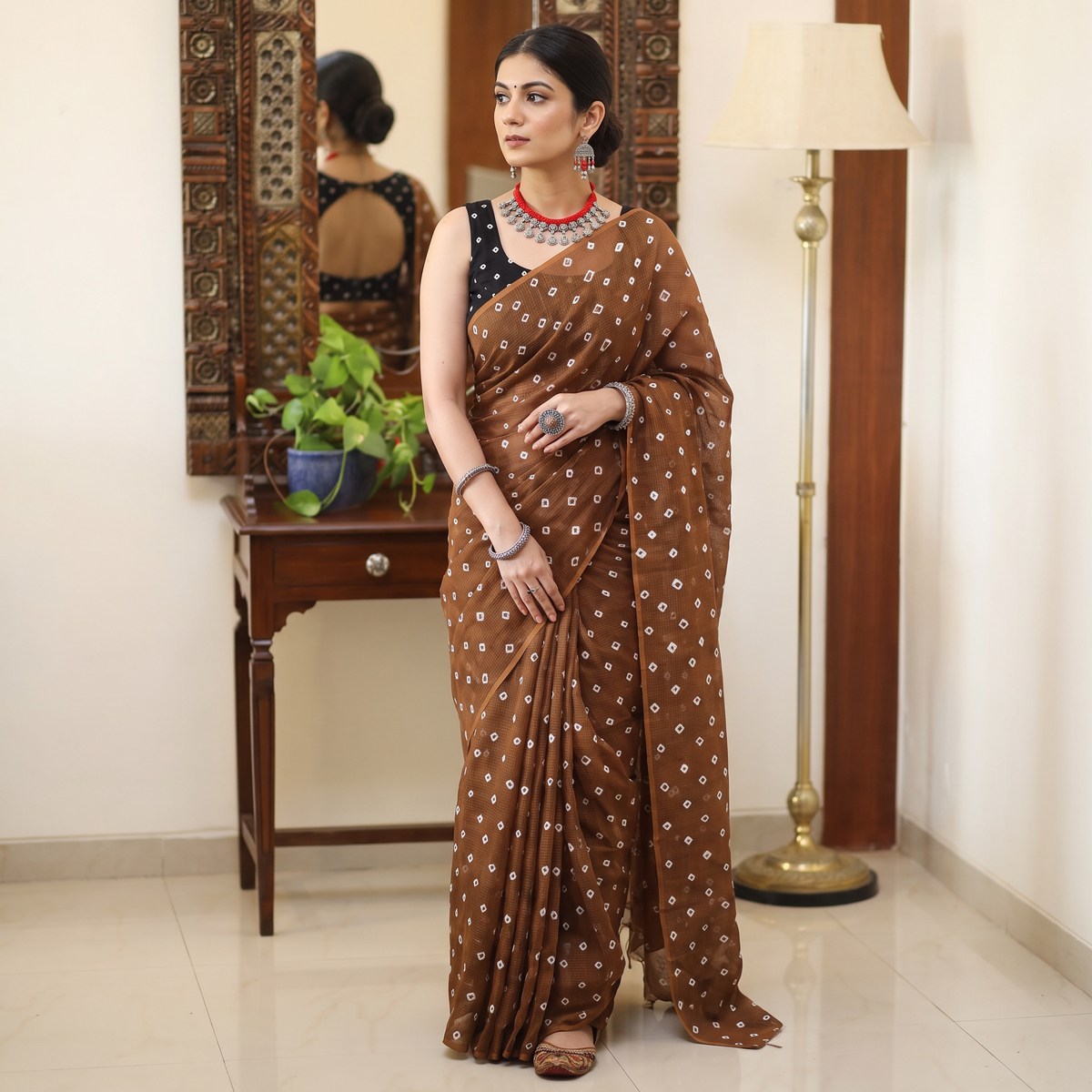 Brown Bandhani tie-dye Kota Doria cotton saree, draped and worn by a woman, AI visual of the saree, iTokri