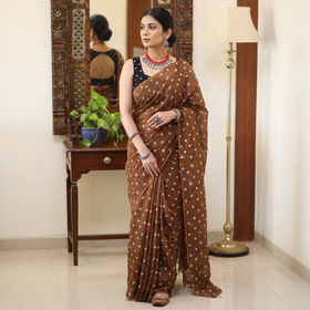 Brown Bandhani tie-dye Kota Doria cotton saree, draped and worn by a woman, AI visual of the saree, iTokri