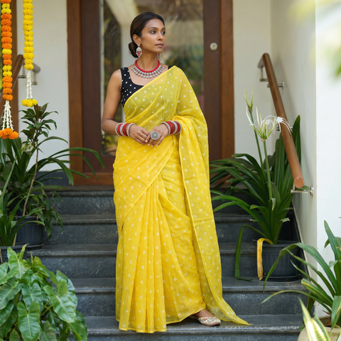 Yellow Bandhani tie-dye Kota Doria cotton saree, draped and worn by a woman, by artisan Adil Hussain, AI visual of the saree, iTokri