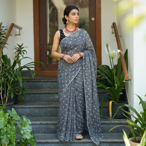 Grey Bandhani tie-dye Kota Doria cotton saree, draped and worn by a woman, AI visual of the saree, iTokri