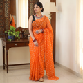 Orange Bandhani tie-dye Kota Doria cotton saree, draped and worn by a woman, by artisan Adil Hussain, AI visual of the saree, iTokri