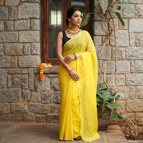Yellow Bandhani tie-dye Kota Doria cotton saree, draped and worn by a woman, AI visual of the saree, iTokri