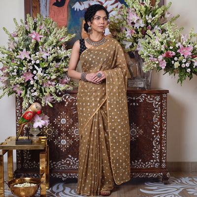 Brown Bandhani tie-dye Kota Doria cotton saree, draped and worn by a woman, by artisan Adil Hussain, AI visual of the saree, iTokri