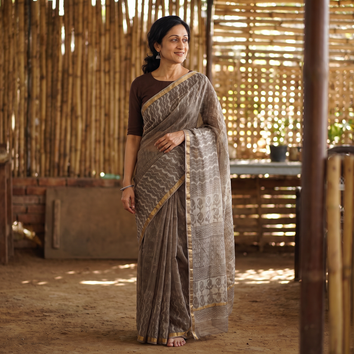 Brown Batik Hand Block Print Kota Doria Cotton Saree, draped and worn by a woman, AI visual of the saree, iTokri