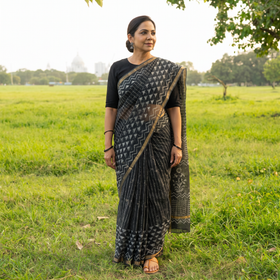 Black Batik Hand Block Print Kota Doria Cotton Saree, draped and worn by a woman, AI visual of the saree, iTokri