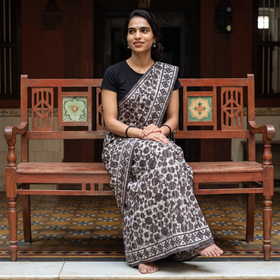 Brown Batik Hand Block Print Pure Mul Cotton Ready To Wear Saree, draped and worn by a woman, AI visual of the saree, iTokri