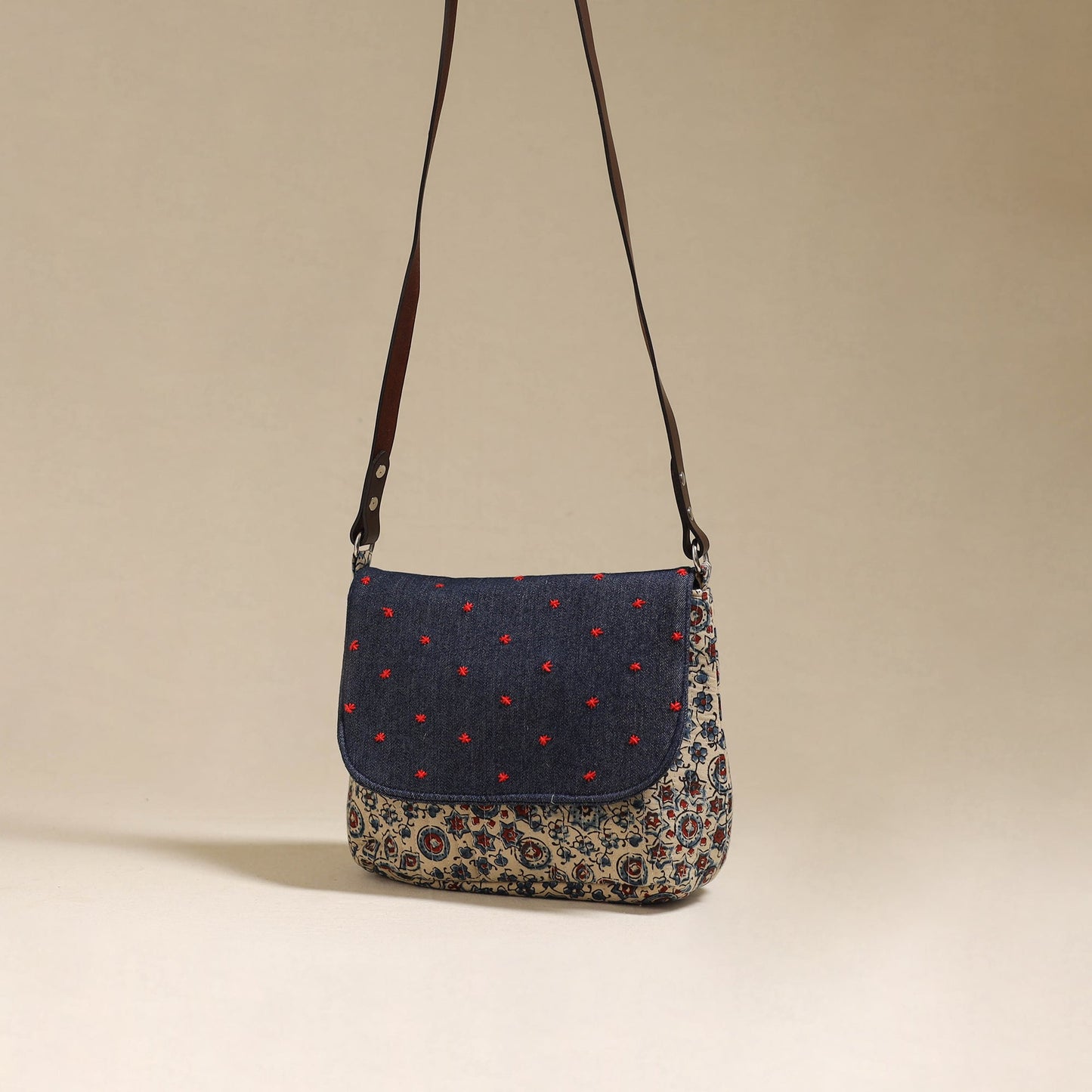 Handcrafted quilted ajrakh block printed fabric sling bag