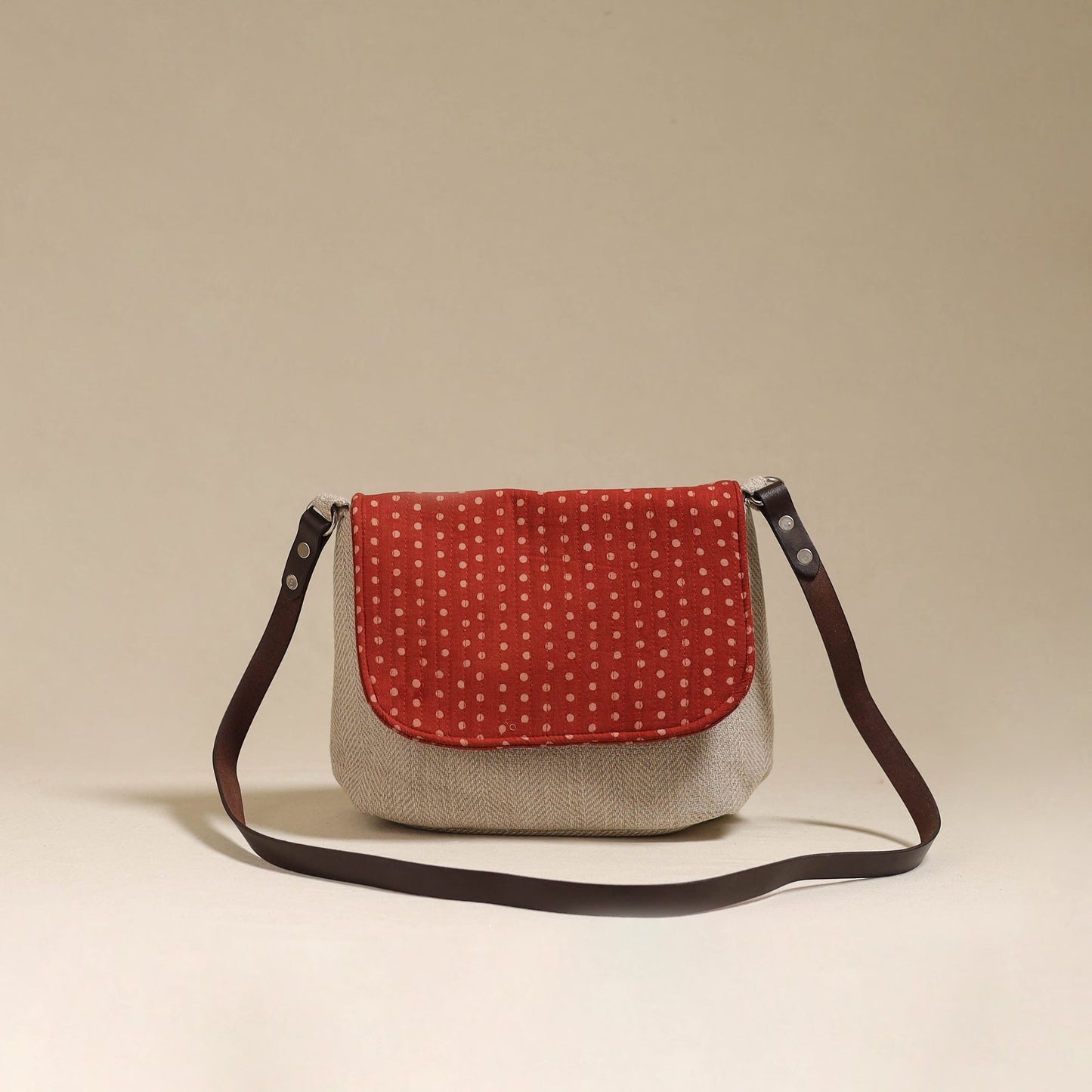 Handcrafted quilted ajrakh block printed fabric sling bag