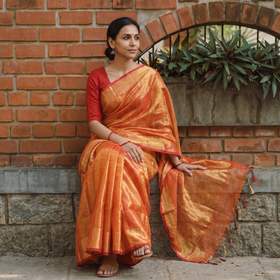 Orange Bengal Fine Tissue Zari Saree, draped and worn by a woman, AI visual of the saree, iTokri