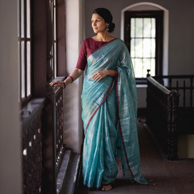 Blue Bengal Fine Tissue Zari Saree, draped and worn by a woman, AI visual of the saree, iTokri