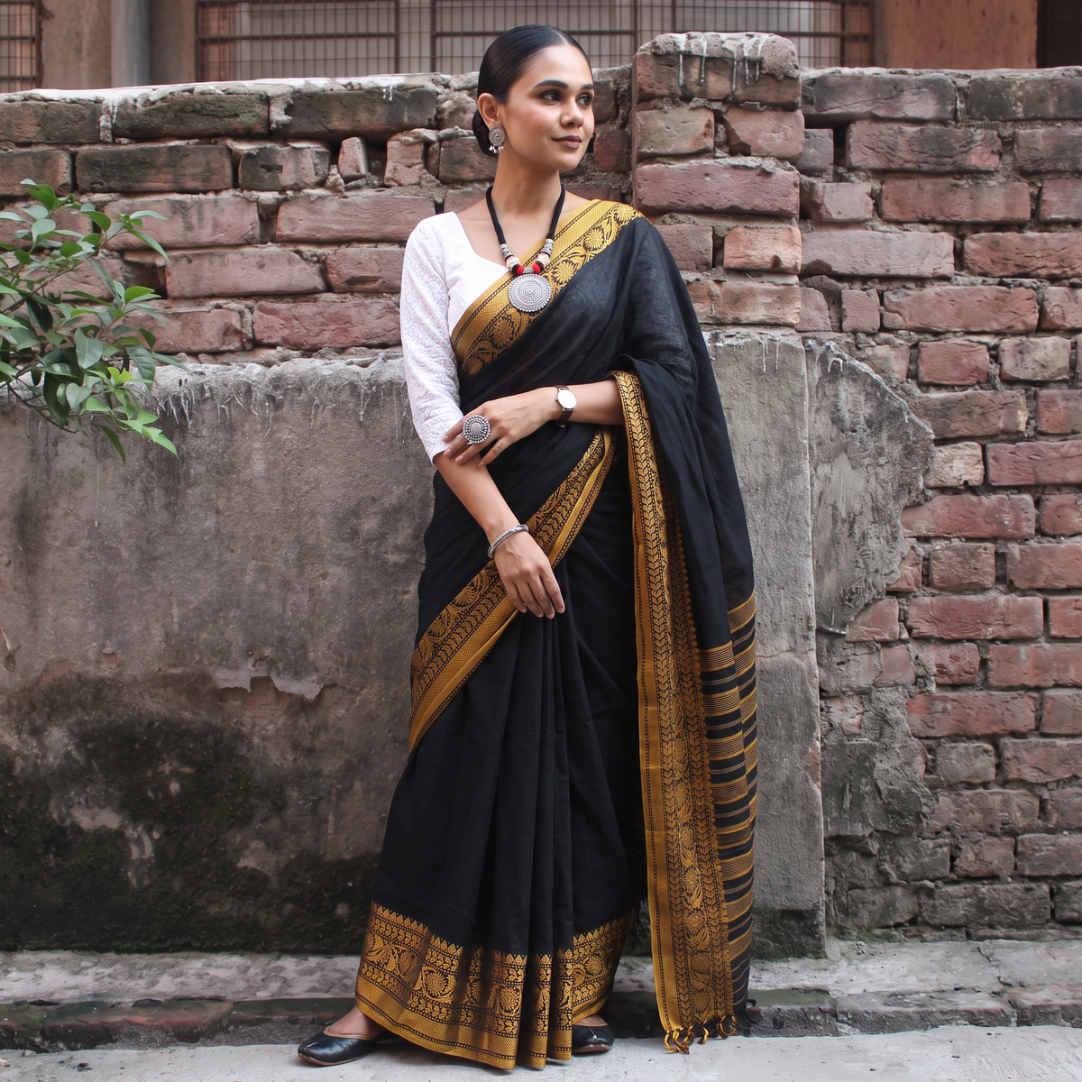 Black Bengal Handwoven Cotton Begumpuri Saree, draped and worn by a woman, AI visual of the saree, iTokri