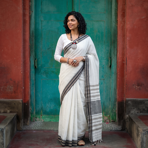 White Bengal Handwoven Cotton Begumpuri Saree, draped and worn by a woman, AI visual of the saree, iTokri