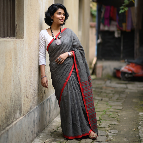 Black Bengal Handwoven Cotton Begumpuri Saree, draped and worn by a woman, AI visual of the saree, iTokri