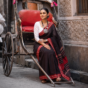 Black Bengal Handwoven Cotton Begumpuri Saree, draped and worn by a woman, AI visual of the saree, iTokri