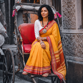 Yellow Bengal Handwoven Cotton Begumpuri Saree, draped and worn by a woman, AI visual of the saree, iTokri