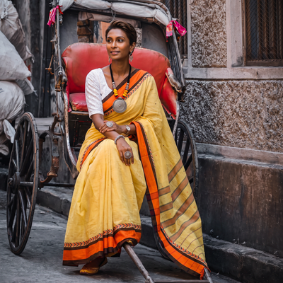Yellow Bengal Handwoven Cotton Begumpuri Saree, draped and worn by a woman, AI visual of the saree, iTokri