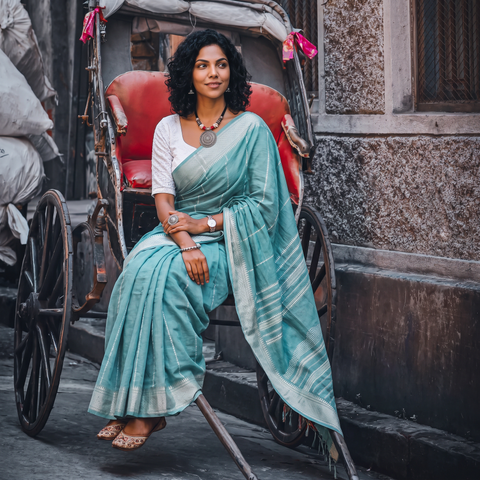 Green Bengal Handwoven Cotton Begumpuri Saree, draped and worn by a woman, AI visual of the saree, iTokri