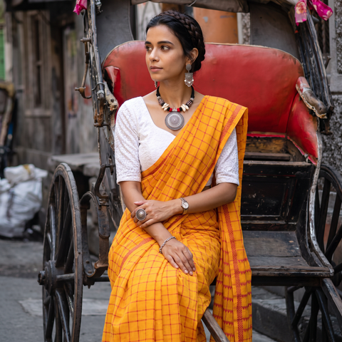 Yellow Bengal Handwoven Cotton Checks Begumpuri Saree, draped and worn by a woman, AI visual of the saree, iTokri