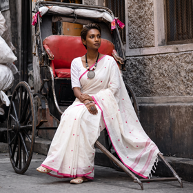 White Bengal Handwoven Cotton Heart Buti Begumpuri Saree, draped and worn by a woman, AI visual of the saree, iTokri