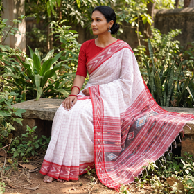 White Bengal Ikat Handwoven Pure Cotton Saree for Durga Puja, draped and worn by a woman, AI visual of the saree, iTokri