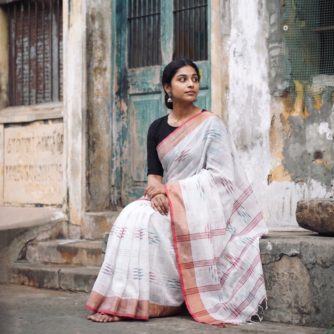 White Bengal Ikat Handwoven Pure Cotton Zari Border Saree for Durga Puja, draped and worn by a woman, AI visual of the saree, iTokri