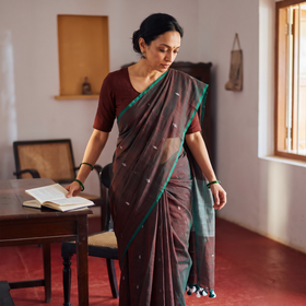Grey Bengal Pure Mul Cotton Jamdani Saree with Tassels, draped and worn by a woman, AI visual of the saree, iTokri