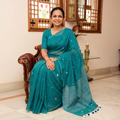 Green Bengal Pure Mul Cotton Jamdani Saree with Tassels, draped and worn by a woman, AI visual of the saree, iTokri