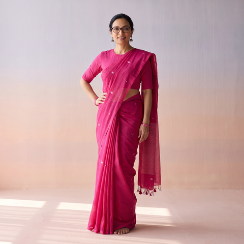 Pink Bengal Pure Mul Cotton Jamdani Saree with Tassels, draped and worn by a woman, AI visual of the saree, iTokri
