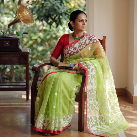Green Bengal Pure Muslin Handloom Jamdani Saree, draped and worn by a woman, AI visual of the saree, iTokri