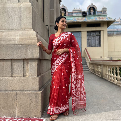 Red Bengal Pure Muslin Handloom Jamdani Saree, draped and worn by a woman, AI visual of the saree, iTokri