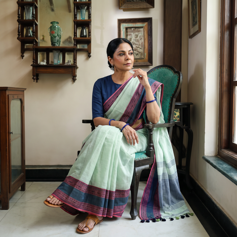 Green Bengal Woven Border Handloom Cotton Saree, draped and worn by a woman, AI visual of the saree, iTokri