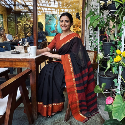 Black Bengal Woven Border Handloom Cotton Saree, draped and worn by a woman, AI visual of the saree, iTokri
