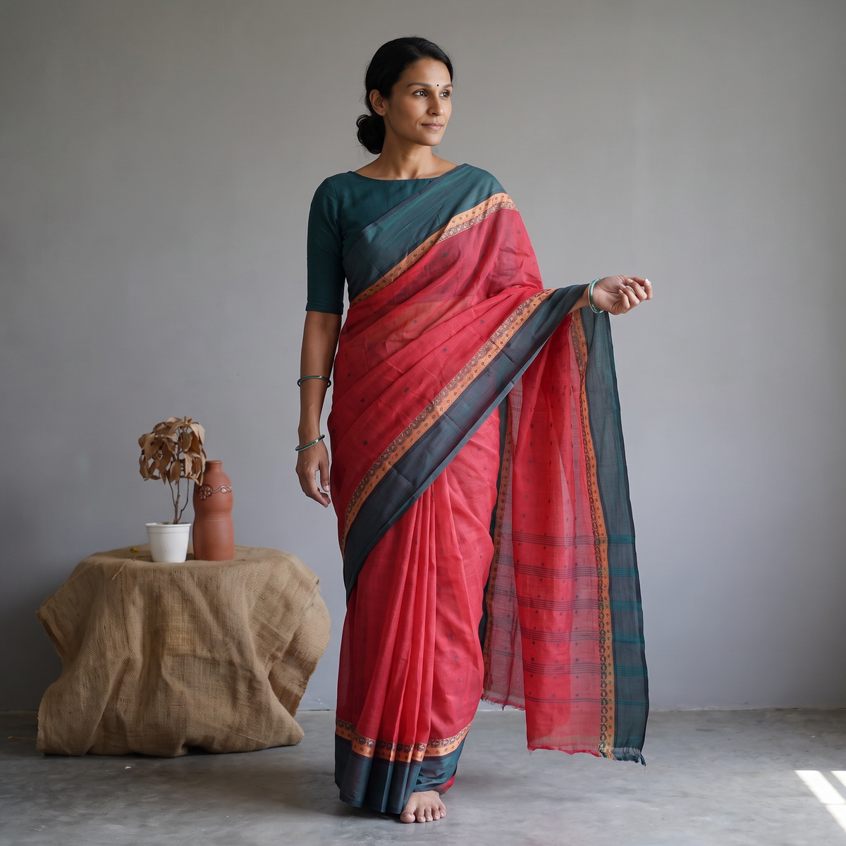 Red Bengali Tant Saree with Matching Jewellery & Blouse, draped and worn by a woman, AI visual of the saree, iTokri