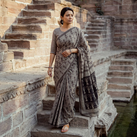 Grey Bindaas Art Block Printed Natural Dyed Cotton Saree, draped and worn by a woman, AI visual of the saree, iTokri