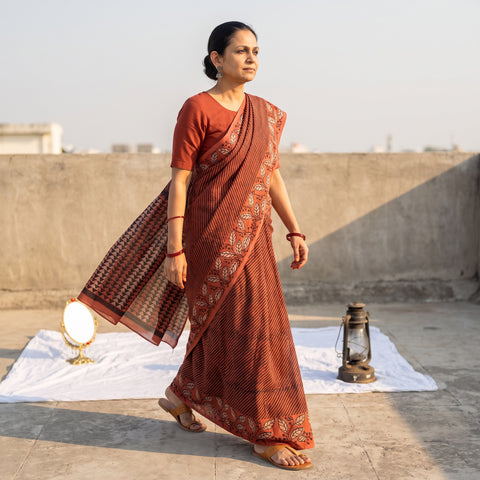 Red Bindaas Art Natural Dyed Cotton Block Print Saree, draped and worn by a woman, AI visual of the saree, iTokri