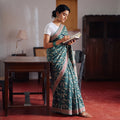 Green Bindaas Art Natural Dyed Cotton Block Print Saree, draped and worn by a woman, AI visual of the saree, iTokri