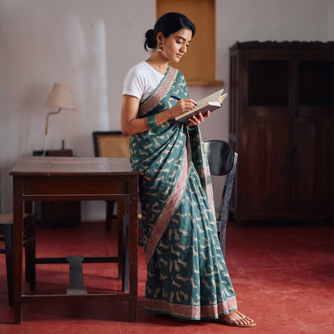 Green Bindaas Art Natural Dyed Cotton Block Print Saree, draped and worn by a woman, AI visual of the saree, iTokri