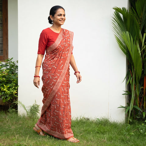 Red Bindaas Art Natural Dyed Cotton Block Print Saree, draped and worn by a woman, AI visual of the saree, iTokri