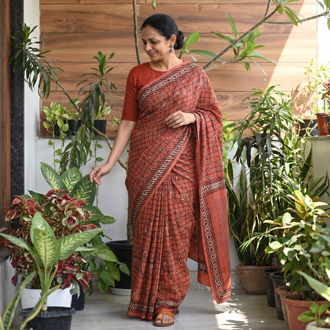 Red Bindaas Art Natural Dyed Cotton Block Print Saree, draped and worn by a woman, AI visual of the saree, iTokri