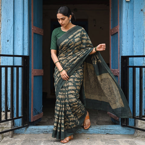 Green Bindaas Art Natural Dyed Cotton Block Print Saree, draped and worn by a woman, AI visual of the saree, iTokri