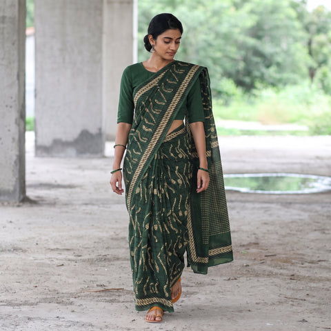 Green Bindaas Art Natural Dyed Cotton Block Print Saree, draped and worn by a woman, AI visual of the saree, iTokri