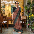 Green Bindaas Art Natural Dyed Cotton Block Print Saree, draped and worn by a woman, AI visual of the saree, iTokri