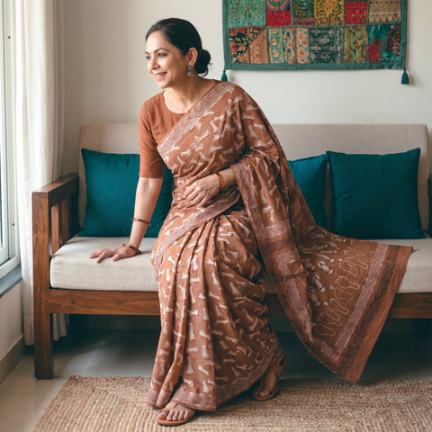 Brown Bindaas Art Natural Dyed Cotton Block Print Saree, draped and worn by a woman, AI visual of the saree, iTokri