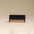 Black - handcrafted ikat fabric jute clutch / wallet